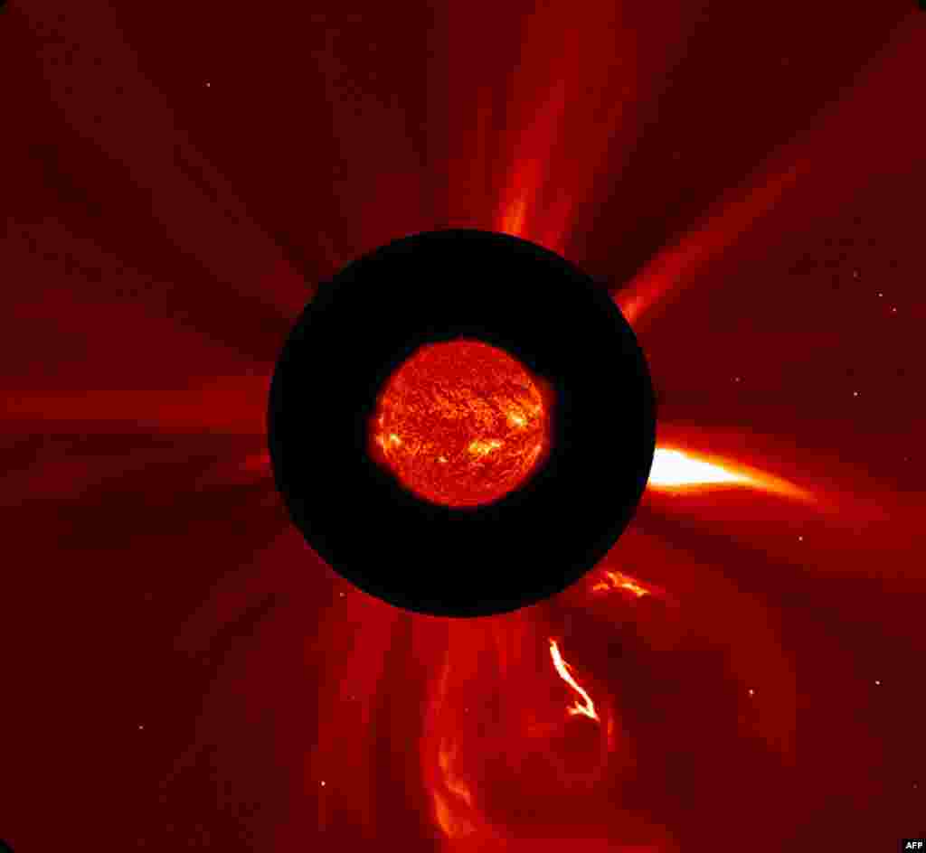 A  European Space Agency (ESA) image released Oct. 31, 2013 shows the Sun in extreme UV light from the Solar Dynamic Observatory superimposed on a visible-light image of the solar corona. Several large, active regions on the Sun burst out with about 20 eruptions between 25-28 Oct. 2013.(AP/ESA-NASA)