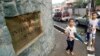 FILE - Indonesian boys walk in front of the Jakarta International School.