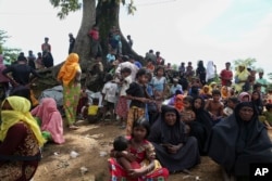 Myanmar's Rohingya Muslims wait to enter the Kutupalong makeshift refugee camp in Cox's Bazar, Bangladesh, Aug. 30, 2017.