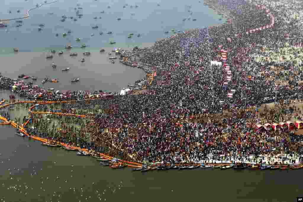 An aerial view of thousands of Hindu devotees taking dips at Sangam, the confluence of three sacred rivers the Yamuna, the Ganges and the mythical Saraswati, on Mauni Amavsya or the new moon day, the most auspicious day during the Kumbh Mela or the Pitcher Festival, in Prayagraj, Uttar Pradesh state, India, Feb. 4, 2019.