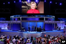 Democratic Presidential candidate Hillary Clinton appears on a large monitor to thank delegates during the second day of the Democratic National Convention in Philadelphia, July 26, 2016.