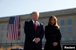 U.S. President Donald Trump and first lady Melania Trump participate in a 9/11 observance at the National 9/11 Pentagon Memorial in Arlington, Virginia, Sept. 11, 2017.