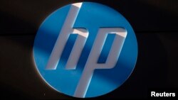 FILE - A Hewlett-Packard logo is seen at the company's Executive Briefing Center in Palo Alto, California.