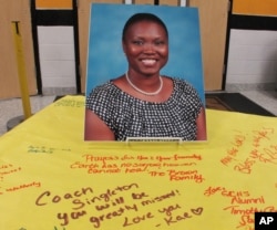 FILE - A picture of Sharonda Coleman-Singleton sits on a large paper signed by students, teachers and friends in Goose Creek, South Carolina, June 18, 2015.