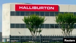 FILE - The company logo of Halliburton oilfield services corporate offices is seen in Houston, Texas.