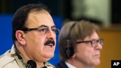 FILE - Chief of Staff of the Free Syrian Army Gen. Salim Idris addresses the media after he discussed the situation in Syria with the leader of the Group of the Alliance of Liberals and Democrats for Europe Guy Verhofstadt, right, at the European Parliament in Brussels, March 6, 2013. 