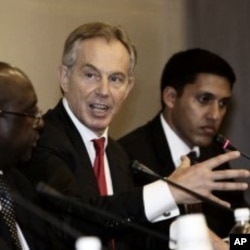 Former British Prime Minister Tony Blair, second from right, during the 4th High-Level Forum on Aid Effectiveness in Busan, South Korea, November 29, 2011.