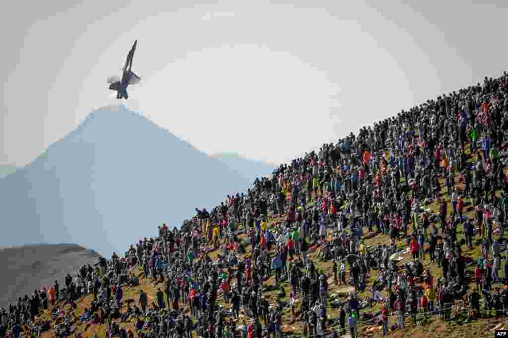 A F/A-18 Hornet fighter aircraft flies over spectators during the annual live fire event of the Swiss Air Force at the Axalp, over Brienz in the Bernese Alp, Switzerland.