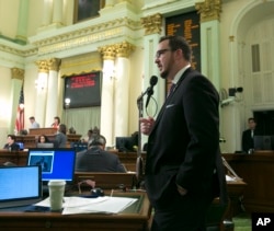 Assemblyman Devon Mathis, R-Visalia, urges lawmakers to reject a "sanctuary state" bill before the Assembly Sept. 15, 2017, in Sacramento, Calif.