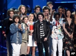 The cast of "Stranger Things" accepts the award for show of the year at the MTV Movie and TV Awards at the Shrine Auditorium in Los Angeles, May 7, 2017.