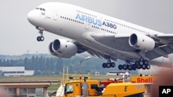 FILE - An Airbus A380 takes off for a demonstration flight at the Paris Air Show in Le Bourget, north of Paris, June 18, 2015.