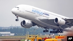 FILE - An Airbus A380 takes off for a demonstration flight at the Paris Air Show in Le Bourget, north of Paris, June 18, 2015.