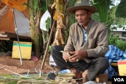 Chhim Being, former Khmer Rouge solider who now sells some vegetable along a street in Anlong Veng, said he also followed the Khmer Rouge after their defeat in 1979. (Sun Narin/VOA Khmer)