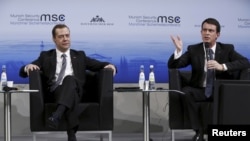 French Prime Minister Manuel Valls (R) and Russian Prime Minister Dmitry Medvedev attend the Munich Security Conference in Munich, Germany, Feb. 13, 2016.