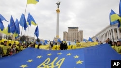 FILE - Pro-European Union activists rally in the center of Kyiv, Ukraine's capital, Oct. 30, 2013.