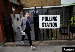 A voter arrives at a polling station in London, Britain June 8, 2017.