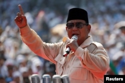 FILE - Indonesia's presidential candidate Prabowo Subianto speaks during a campaign rally with his running mate Sandiaga Uno at Gelora Bung Karno Main Stadium in Jakarta, Indonesia, April 7, 2019.