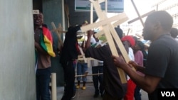 Members of various church groups take to the streets in Harare to express their dismay over the national pledge.