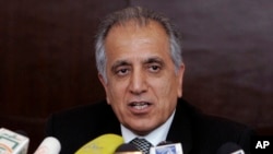  Zalmay Khalilzad, chefe da delegaçao americana ás negociações