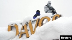 A snipper holds his position on the roof of a hotel during the World Economic Forum (WEF) annual meeting in the Swiss Alps resort of Davos, Switzerland, Jan. 22, 2018 