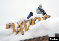 A snipper holds his position on the roof of a hotel during the World Economic Forum (WEF) annual meeting in the Swiss Alps resort of Davos, Switzerland, Jan. 22, 2018