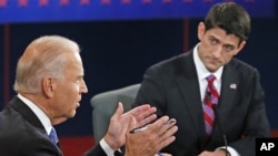 Vice President Joe Biden (l) and Republican vice presidential nominee Rep. Paul Ryan of Wisconsin participate in the vice presidential debate at Centre College, in Danville, Kentucky, Oct. 11, 2012.
