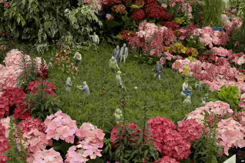 Figurines are displayed as part of the Floella&#39;s Future stand at the RHS (Royal Horticultural Society) Chelsea Flower Show in London.