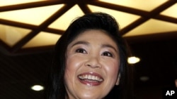 Prime Minister-elect Yingluck Shinawatra of the Puea Thai Party addresses reporters at her party's headquarters in Bangkok, July 19, 2011.