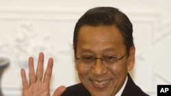 Indonesian Vice President Boediono, also former governor of the central bank, gestures to reporters upon arrival before the start of the televised speech of President Susilo Bambang Yudhoyono at Freedom Palace in Jakarta, Indonesia, March 4, 2010.