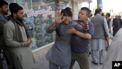 A shocked man shouts slogans against President Ghani after he ran out of the Shiite mosque during an ongoing attack, Kabul, Afghanistan, Aug. 25, 2017. 