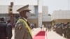 FILE - Interim Malian President, Colonel Assimi Goita, looks on at members of the Malian Armed Forces after his swearing in ceremony in Bamako on June 7, 2021.