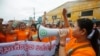FILE - Garment workers shout during a protest calling for higher wages in Phnom Penh Sept. 17, 2014.