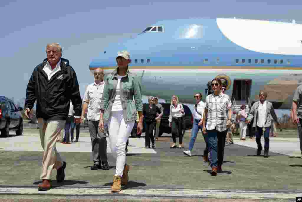 President Donald Trump and first lady Melania Trump arrive at Luis Muniz Air National Guard Base to survey hurricane damage and recovery efforts, Oct. 3, 2017, in San Juan, Puerto Rico.