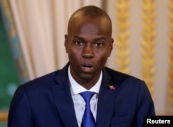 FILE - Haitian President Jovenel Moise speaks during a press conference at the Elysee Palace in Paris, France, Dec. 11, 2017.