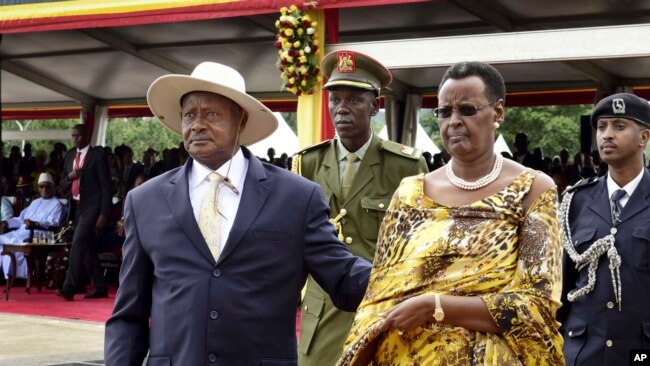 FILE - Uganda's long-time president Yoweri Museveni and his wife Janet Museveni, right, attend his inauguration ceremony in the capital Kampala, May 12, 2016. 