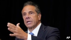 FILE - Then-New York Governor Andrew Cuomo speaks during a news conference at New York's Yankee Stadium, July 26, 2021.