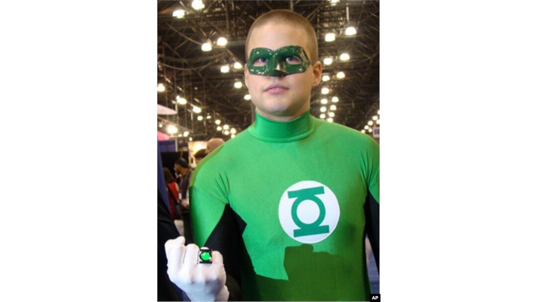 This is a Green Hornet lookalike, but the outfit is not atypical for true-life vigilantes who throw themselves into their roles.