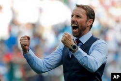 England head coach Gareth Southgate celebrates his team's 6-1 victory at the end of the group G match between England and Panama at the 2018 soccer World Cup at the Nizhny Novgorod Stadium in Nizhny Novgorod , Russia, Sunday, June 24, 2018.