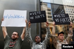 FILE - U.S. military veterans (R-L) Perry O'Brien, Claude Copeland and Julio Torres demonstrate outside Republican presidential candidate Donald Trump's news conference outside Trump Tower in New York, May 31, 2016.