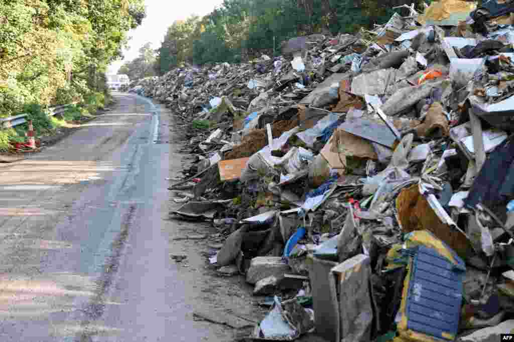 A large amount of trash is seen on the abandoned A601 highway at Juprelle, near Liege. The makeshift trash area — stretching a total eight kilometers (five miles) in both directions of the closed motorway — is a physical representation of the damage caused by floods in mid-June.