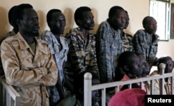 South Sudanese soldiers suspected of raping five foreign aid workers and killing their local colleague are seen before appearing in a military court in South Sudan's capital Juba, May 30, 2017.