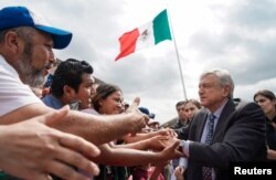 Mexico's President Andres Manuel Lopez Obrador greets people during an official event in Piedras Negras, Coahuila state, Mexico, May 5, 2019.