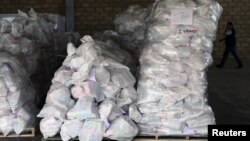 FILE - Sacks containing humanitarian aid are pictured at a warehouse near the Tienditas cross-border bridge between Colombia and Venezuela in Cucuta, Colombia, Feb. 14, 2019. 