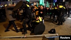 Riot police clash with demonstrators in the streets near the Turkish consulate in Rotterdam, Netherlands, March 12, 2017.