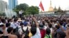 A student activist speaks during a rally protesting constitutional amendments June 30, 2015, in downtown Yangon, Myanmar.