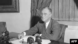 President Franklin Roosevelt shown at his desk at the White House