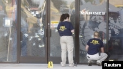 FBI agents work the scene at the Armed Forces Career Center in Chattanooga, Tennessee, July 16, 2015. 
