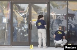 FBI agents work the scene at the Armed Forces Career Center in Chattanooga, Tennessee, July 16, 2015.