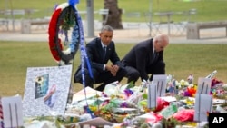 President Barack Obama and Vice President Joe Biden visit a memorial to the victims of the Pulse nightclub shooting in Orlando, Florida, June 16, 2016.