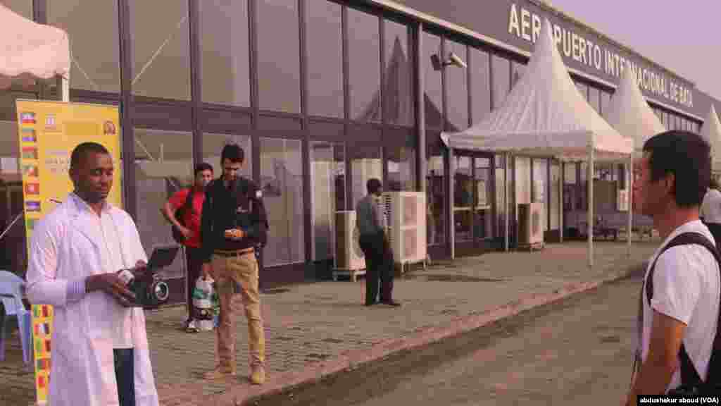 Doctors test passengers' temprature as they arrive in Bata, Equatorial Guinea